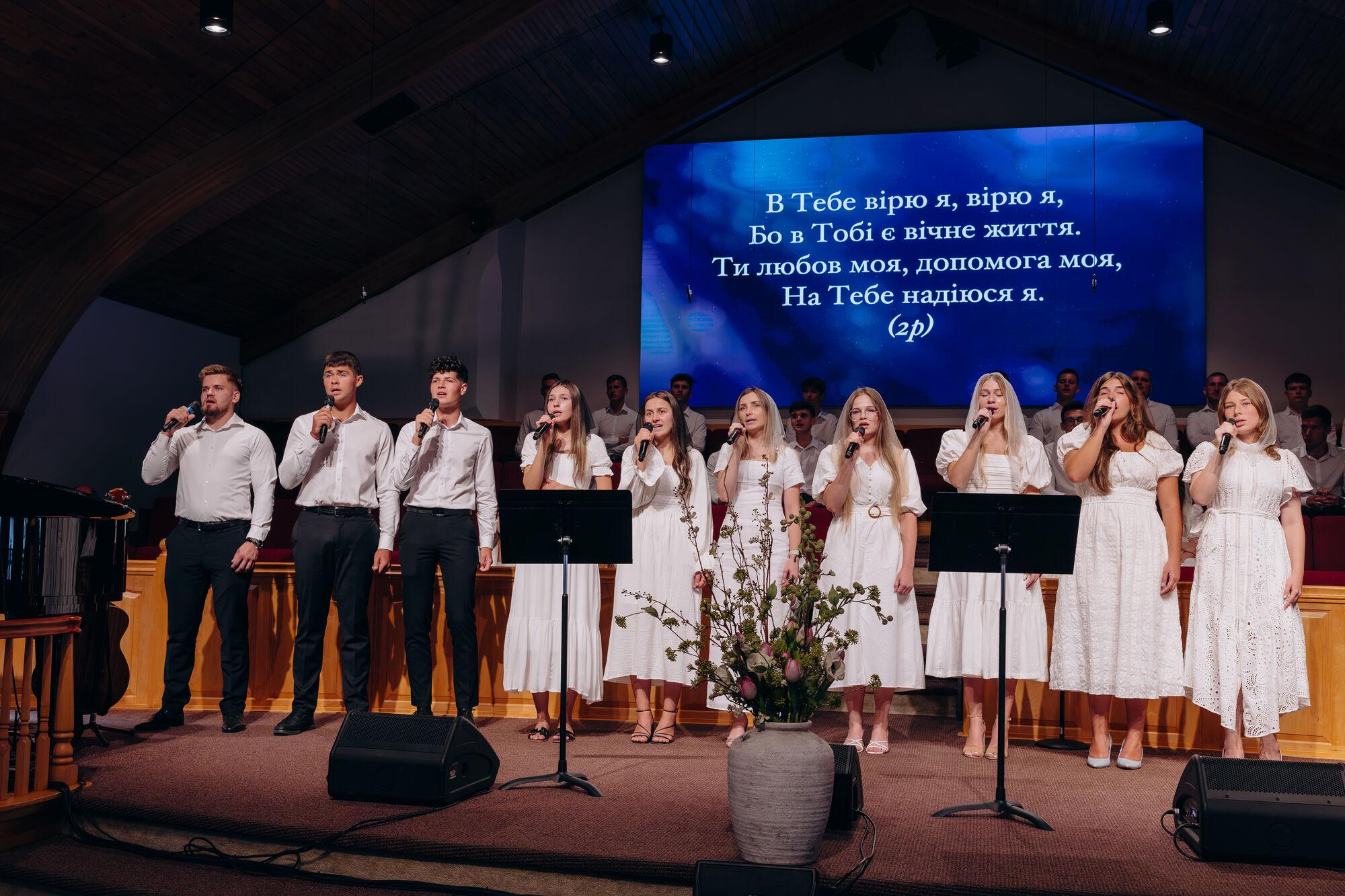 Teens singing during worship