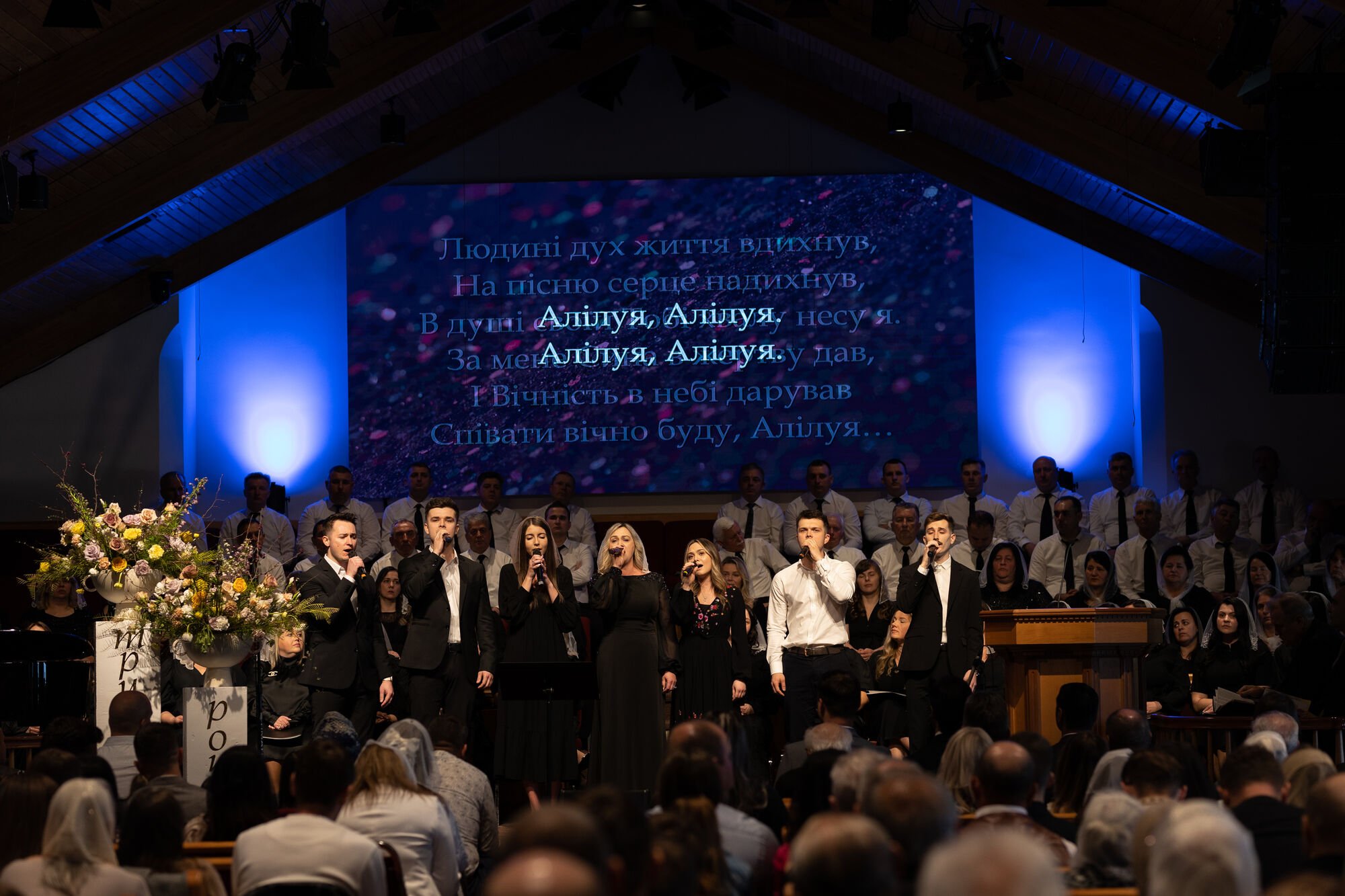 Worship team singing on stage